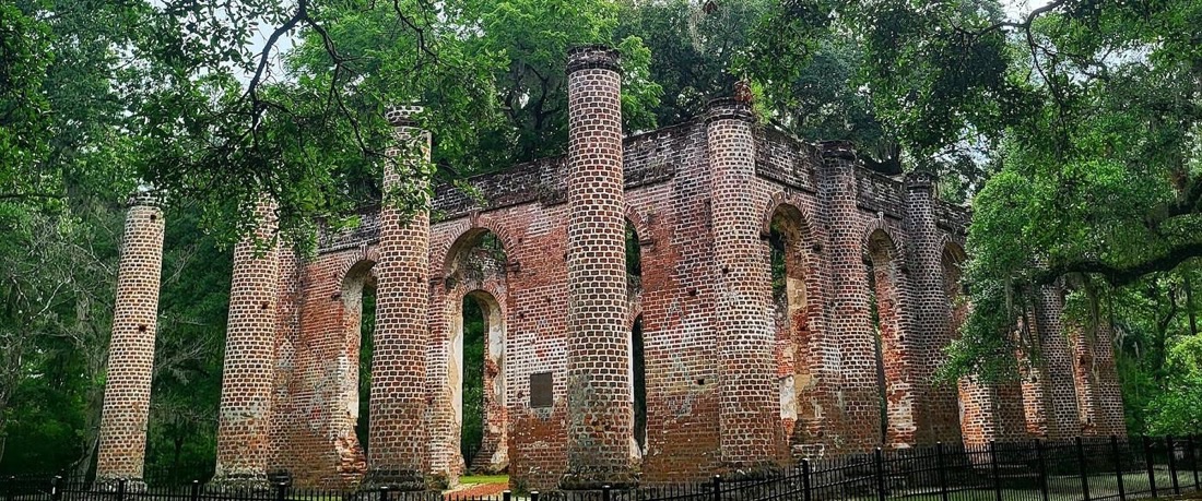 The brick ruins and standing columns of Old Sheldon Church under live oaks — the first stop on the trip